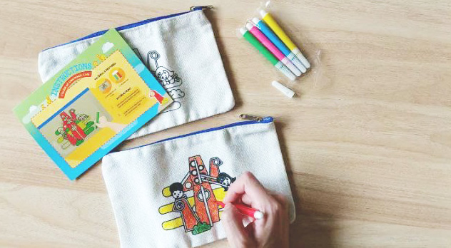 Colouring in your very own canvas pencil case.